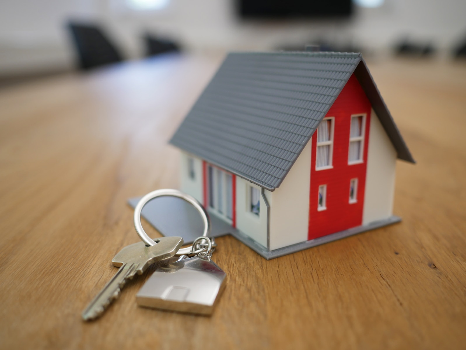 Schattingen white and red wooden house miniature on brown table